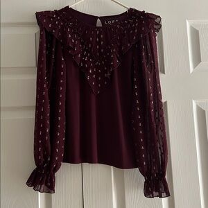 LOFT Burgundy Ruffle Blouse with sheer arms.  Silver threading for embellishment